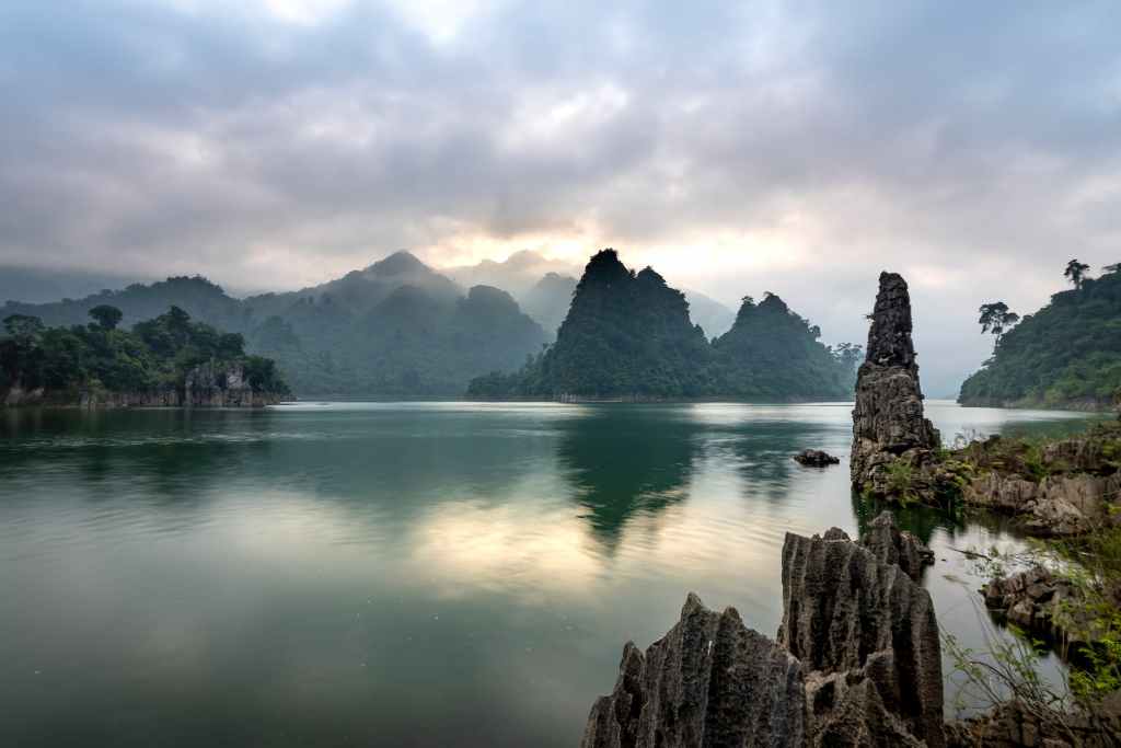 scenery of lake surrounded by hills and cliffs