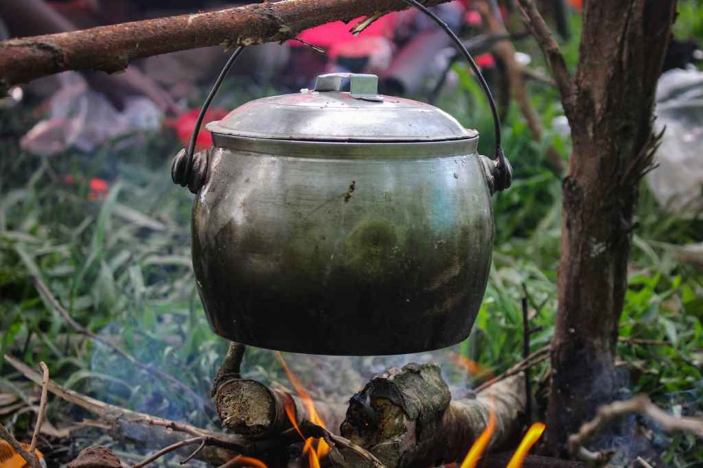 photo of food being cooked in a cauldron